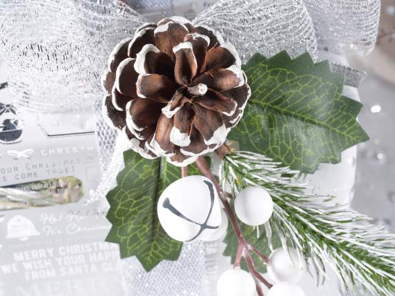 Sprig with snow-covered pine cone, white berries and bell
