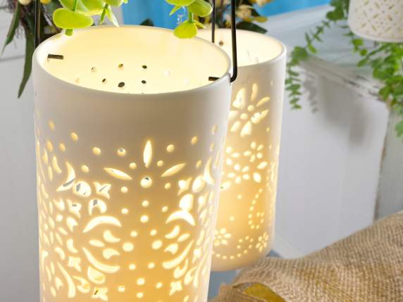 Opaque porcelain lantern with carved decorations, lights and