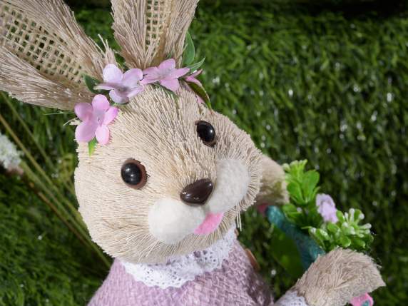 Natural fiber bunny on a bicycle with flowers