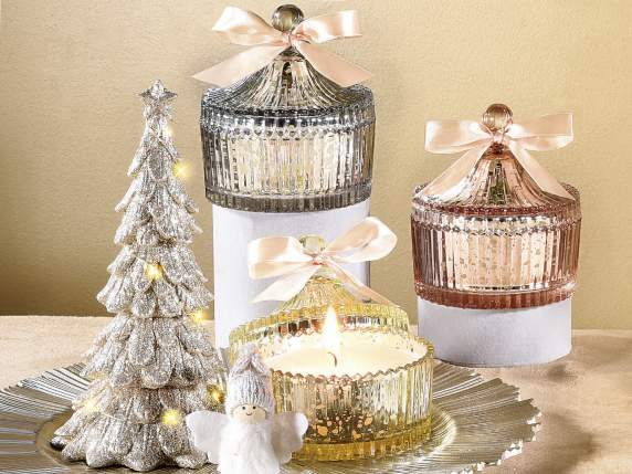 Scented candle in shiny glass jar with lid
