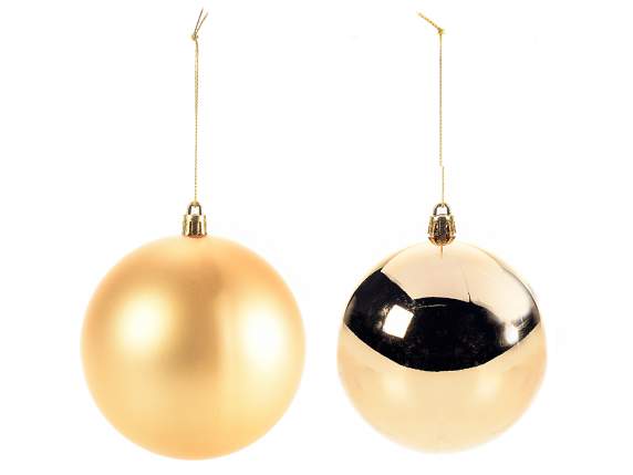 Matte and glossy gold plastic ball in pack. Christmas