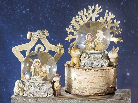 Snow globe with nativity scene and resin decorated base