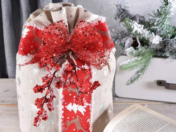 Snow-covered branch of red berries