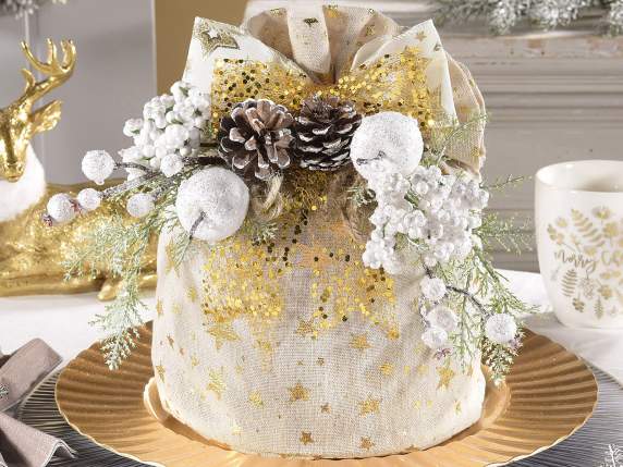 Snow-covered sprig with pine cone, apple and white frosted b