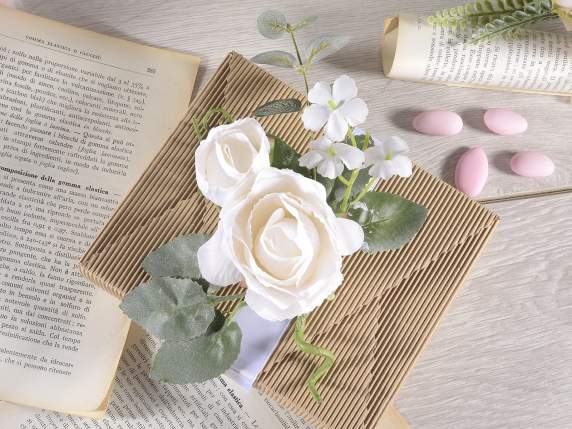 Sprig of rose in white fabric with bud and small flowers