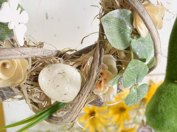 Wooden garland and boater with flowers and eggs