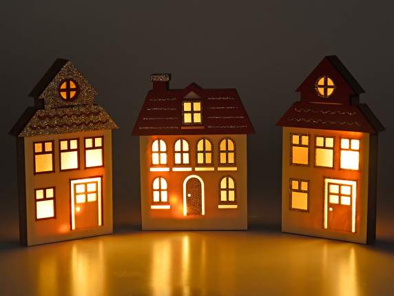 Wooden house with golden glitter and led light to be placed