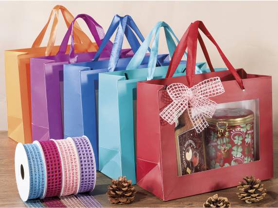 Large colored paper envelope with fabric handles and window