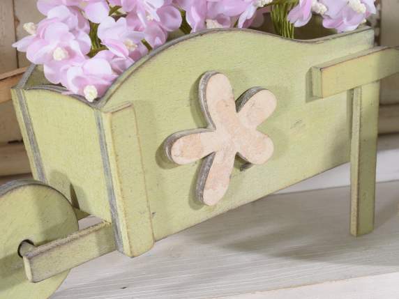 Decorative wheelbarrow in colored wood with flower