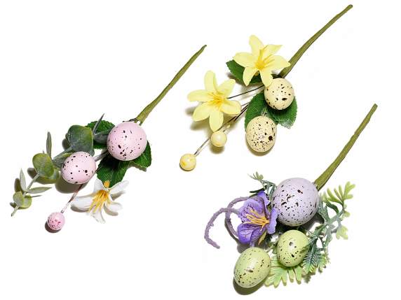 Artificial bouquet of colored eggs with leaves and flowers