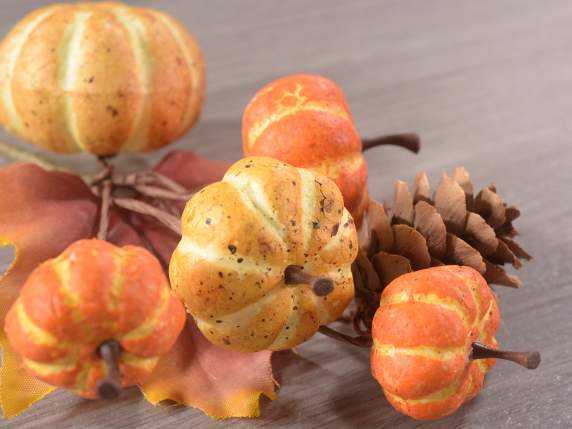Sprig with artificial pumpkins and pine cone