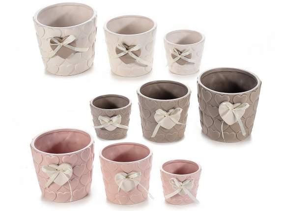 Set of 3 ceramic vases with embossed decorations and applied