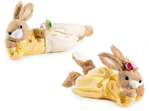 Fiber rabbit lying thoughtfully with cloth clothes