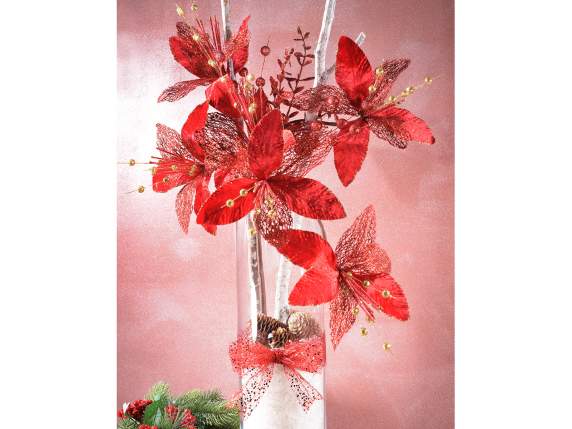 Red poinsettia branch with glitter berries