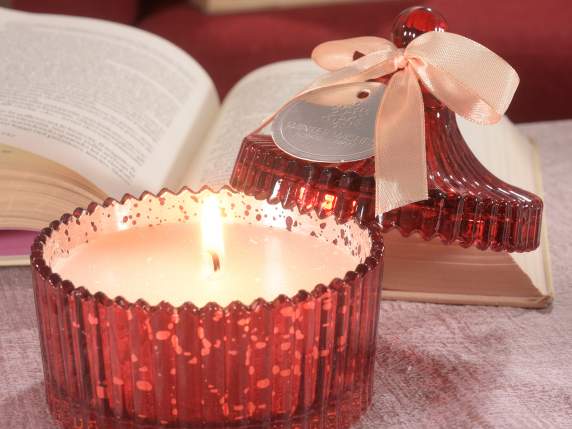 Scented candle into a glossy glass jar with cover