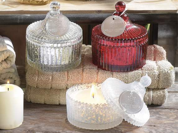 Scented candle in shiny glass jar with lid