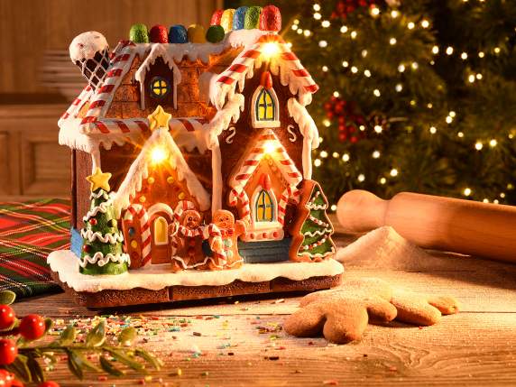 Maison en pain dépices en résine colorée avec lumières