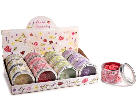 Bougie parfumée avec fleur en relief dans une boîte en métal