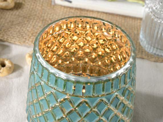Colored glass candle holder decorated with golden details