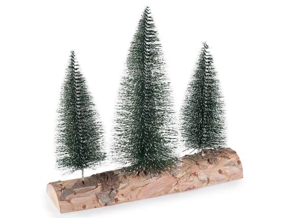 Rondin de bois avec 3 sapins artificiels enneigés