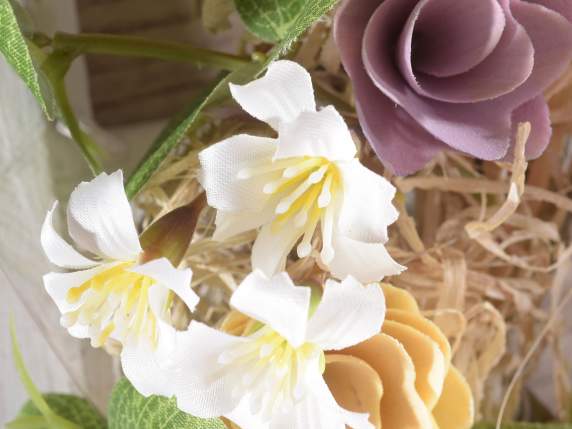 Wooden wreath with colorful flowers made of wood and fabric