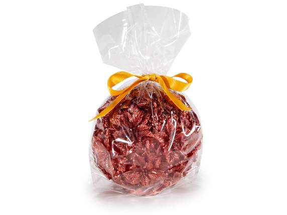 Bougie boule rouge avec décorations florales de Noël