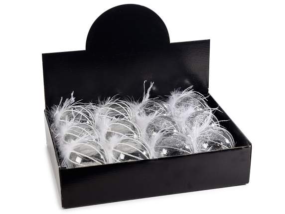 Boule en verre transparent avec pailles et plumes