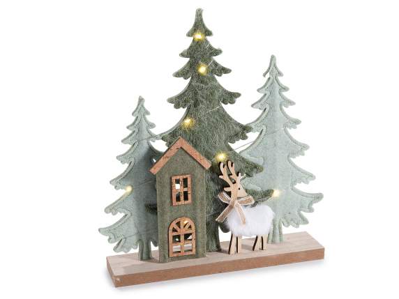 Wood and cloth landscape with house, eco fur reindeer