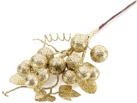 Ramo di bacche e foglie dorate glitterate