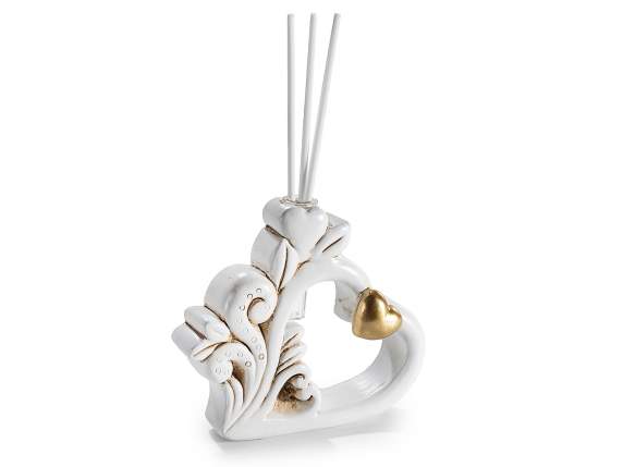 Corazón de resina con corazón dorado y varilla perfumada.