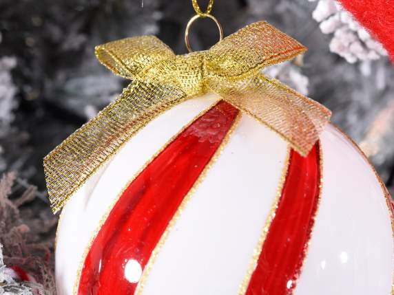 Glass ball to hang with gold glitter and bow on display
