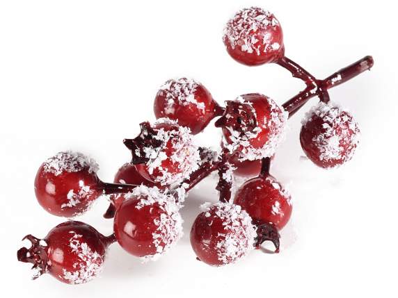Sprig of artificial red snow capped berries