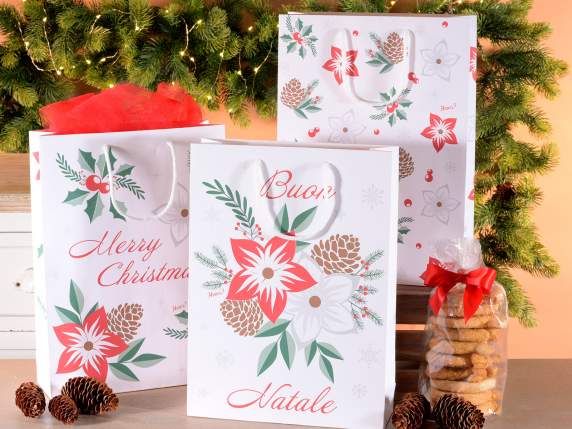 Bolsa-sobre de papel grande con estrellas navideñas y asas.