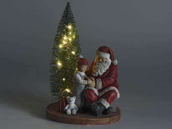 Sapin de Noël avec Père Noël et enfant en résine et lumières