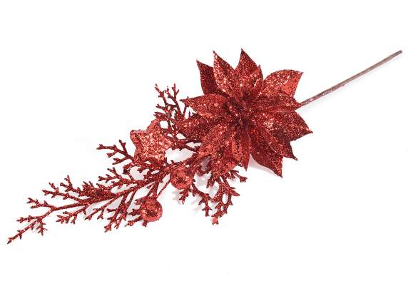 Branche rouge avec poinsettia, baies et étoile scintillante