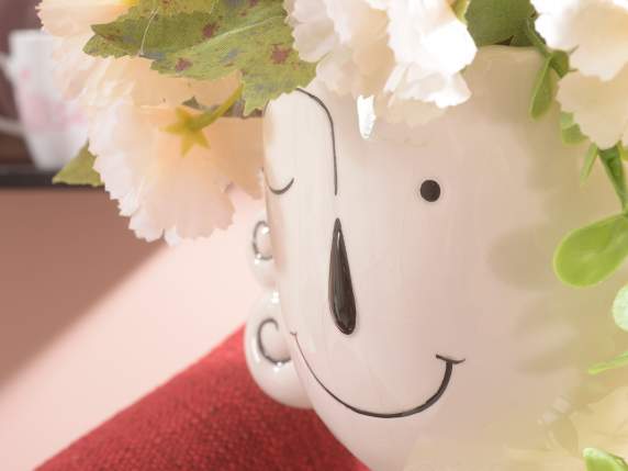 Vase décoratif en porcelaine avec visage souriant