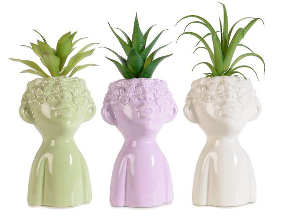 Glossy ceramic face vase with artificial plant
