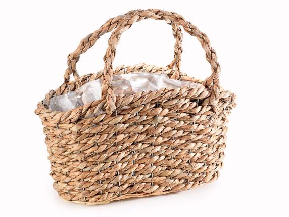 Basket in twisted natural fiber with handles
