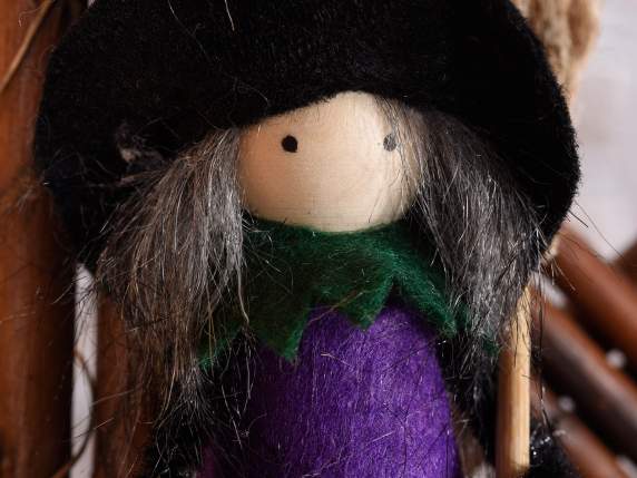 Witch-Befana in cloth with broom to hang