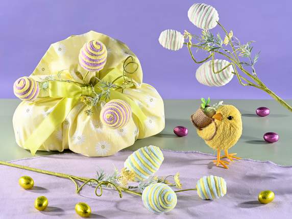 Modeling branch with fabric eggs and artificial flowers