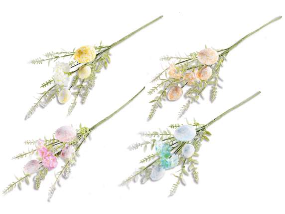 Branch of colored eggs and artificial leaves