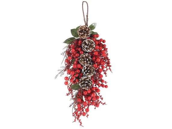 Branch with red berries and snow-covered pine cones to hang