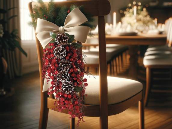 Branch with red berries and snow-covered pine cones to hang