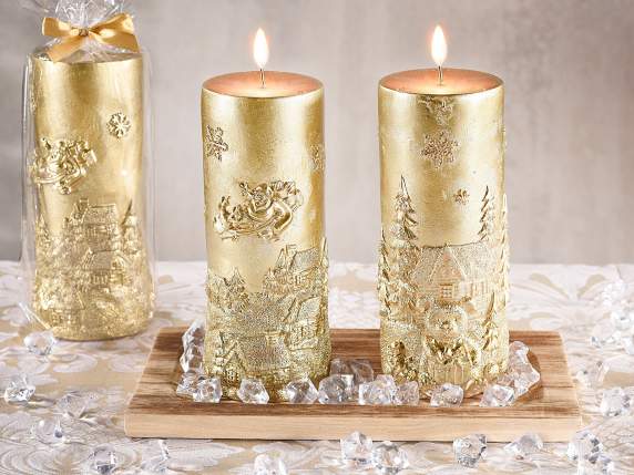 Large golden candle with embossed Christmas landscape