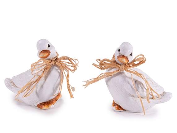 Colorful ceramic duck with raffia bow