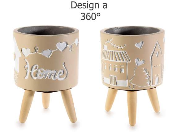 Concrete vase on wooden tripod with Home writing
