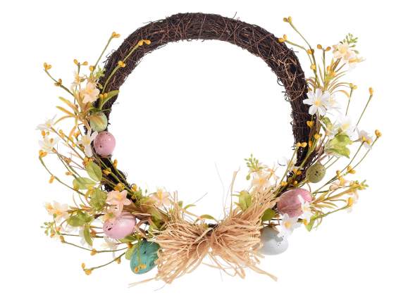 Garland of colored eggs with raffia bow and flowers