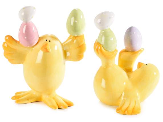 Juggling chick with colored ceramic eggs to stand