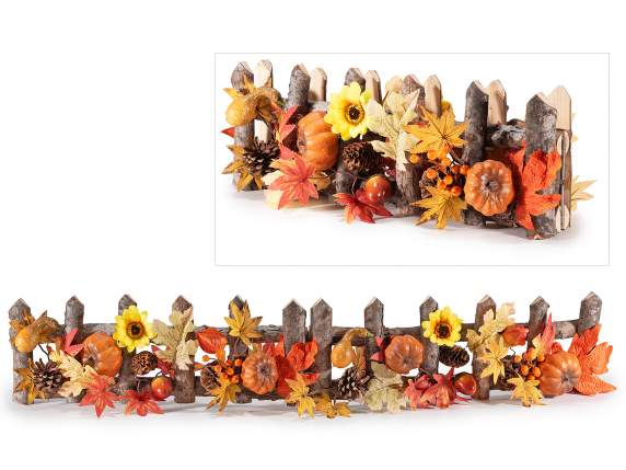 Wooden fence with berries, pumpkins and autumn leaves