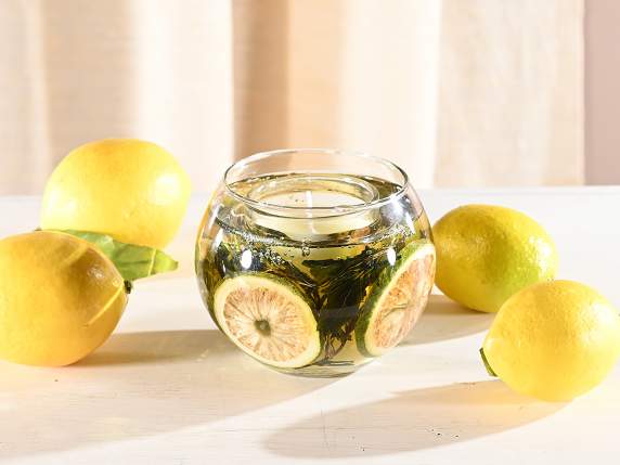 Scented candle in glass jar with gel and natural decorations